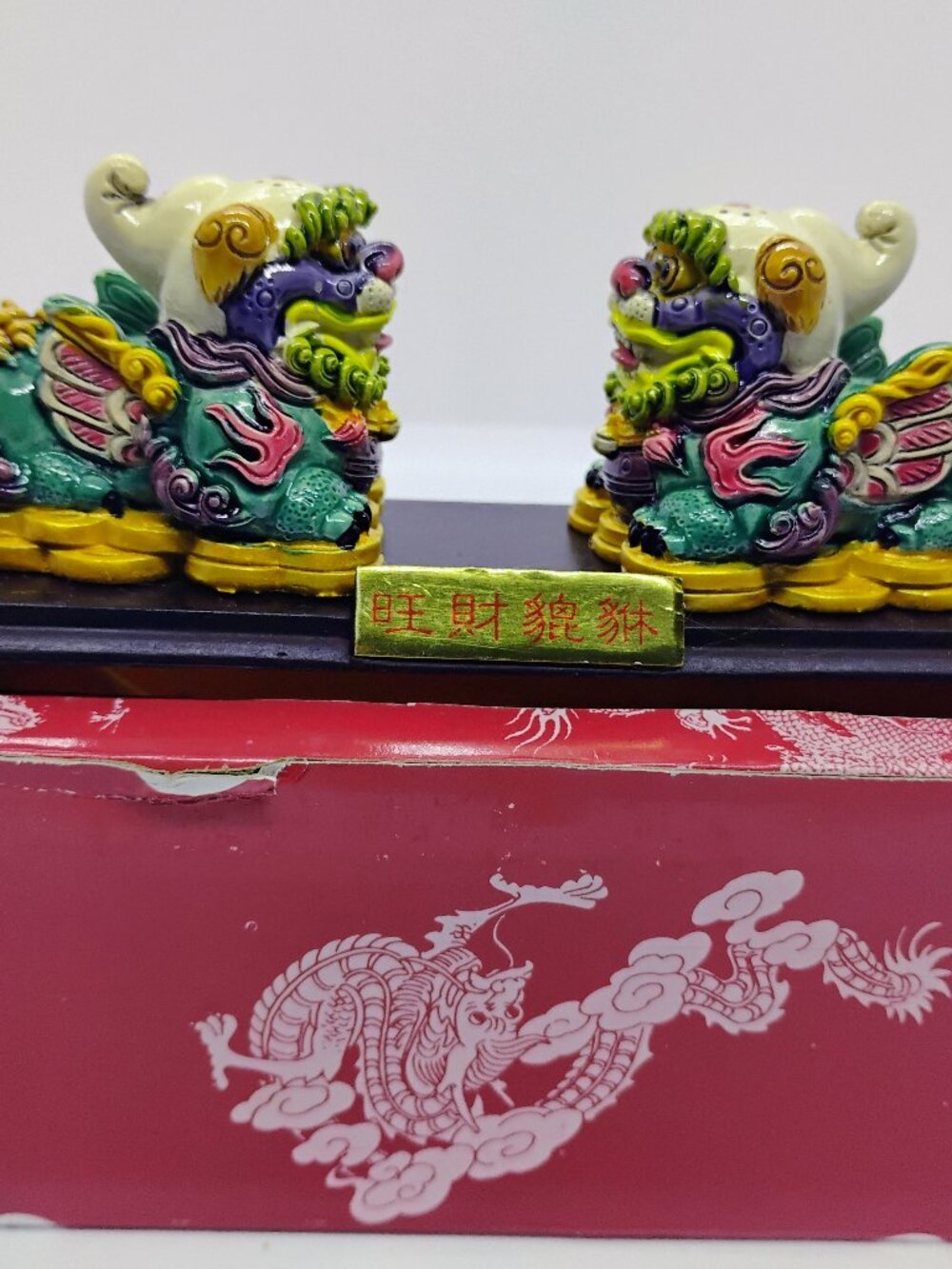 NEW in box pair of resin figurine-mythical creature dogs for prosperity.